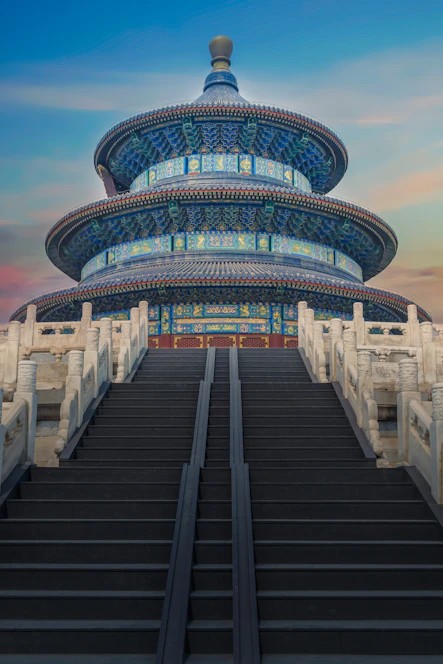 low-angle photography of blue 3-storey cone temple