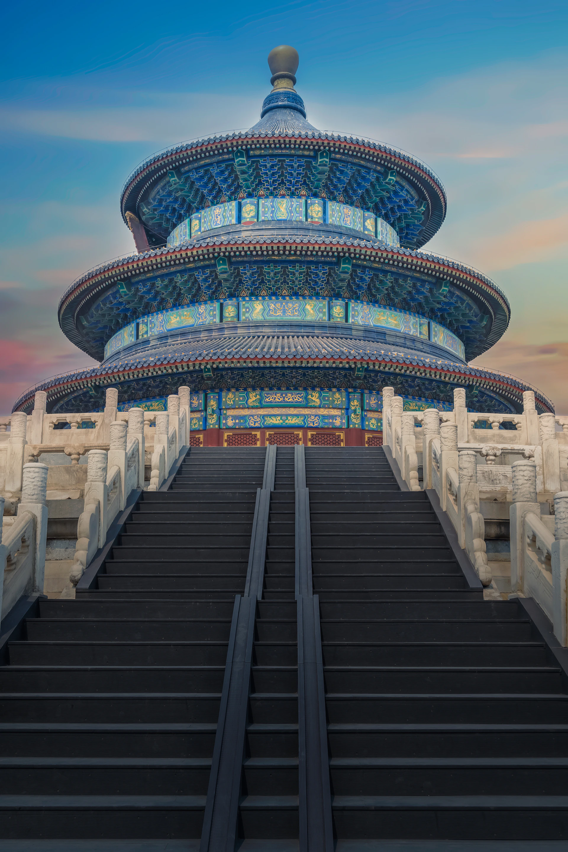 low-angle photography of blue 3-storey cone temple