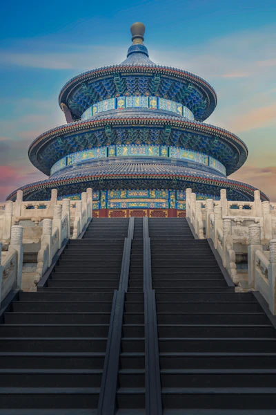 low-angle photography of blue 3-storey cone temple