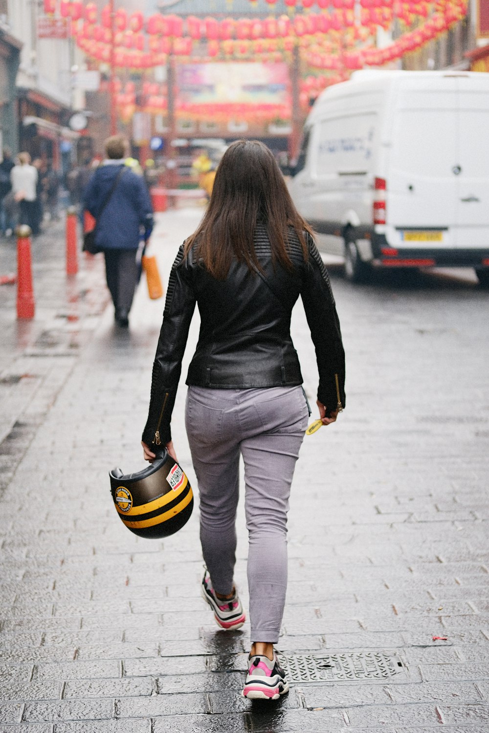 woman holding helmet