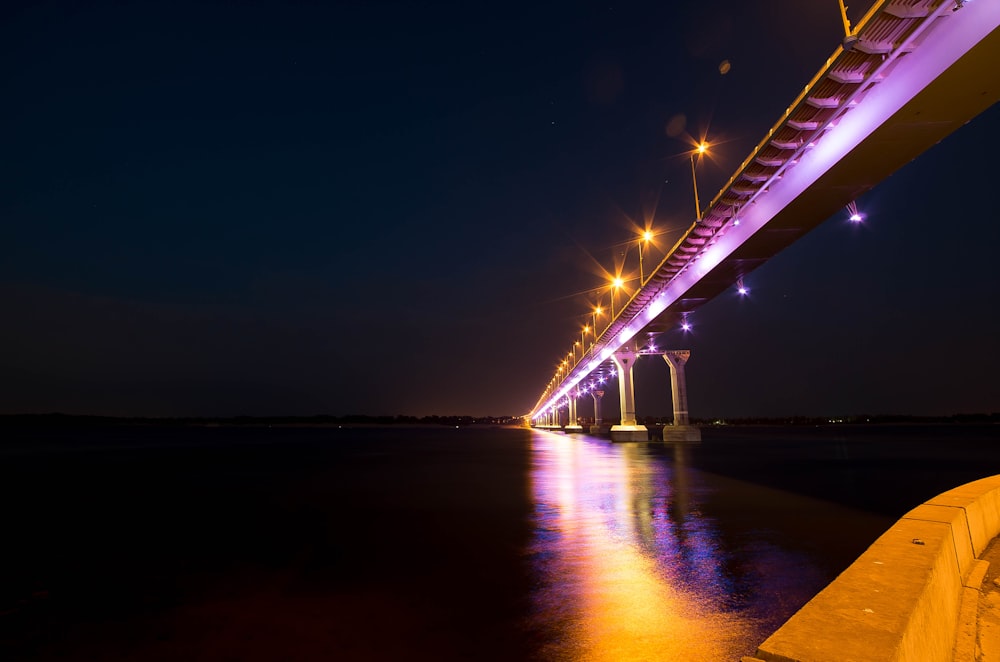 lighted bridge during night