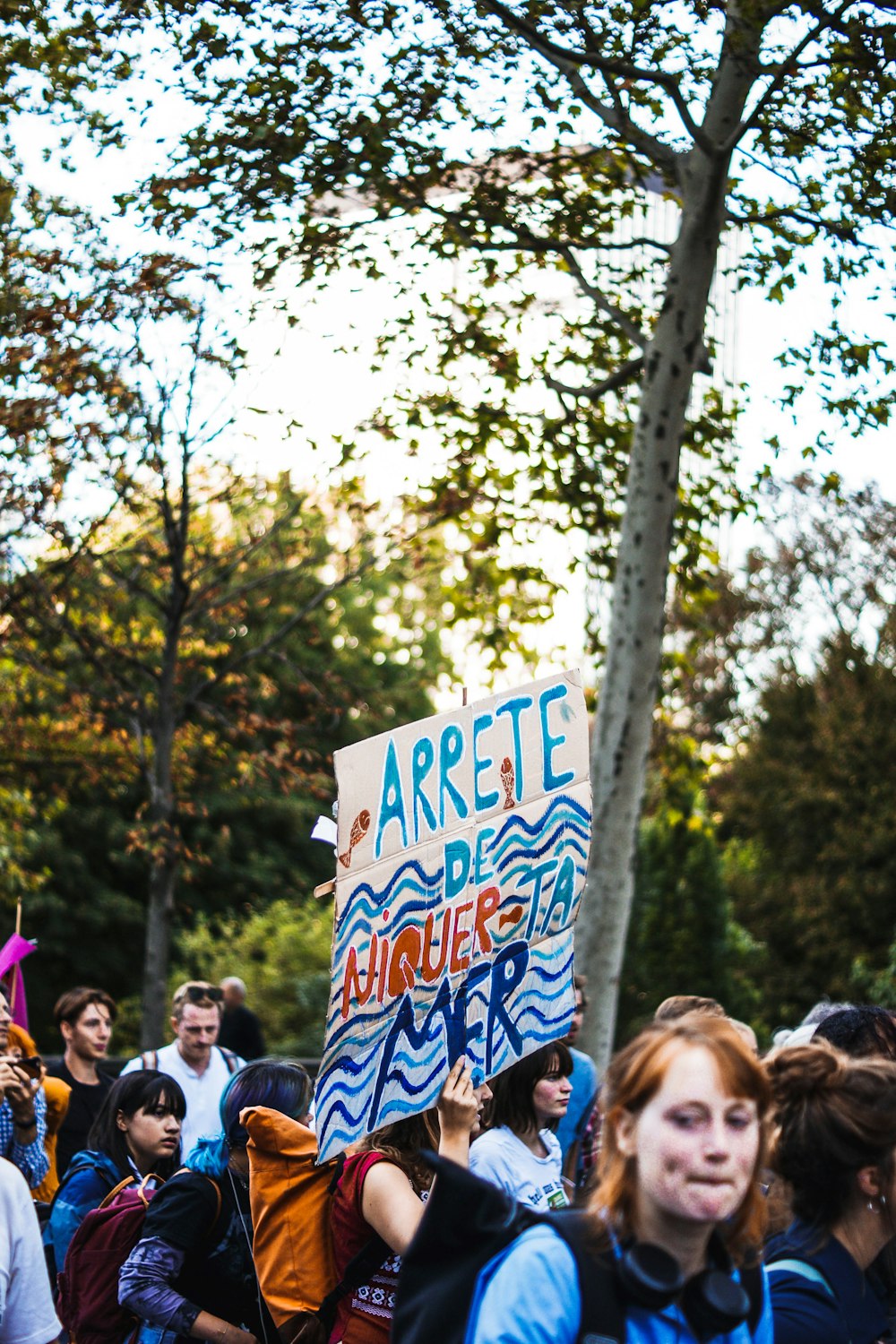 people rallying near trees