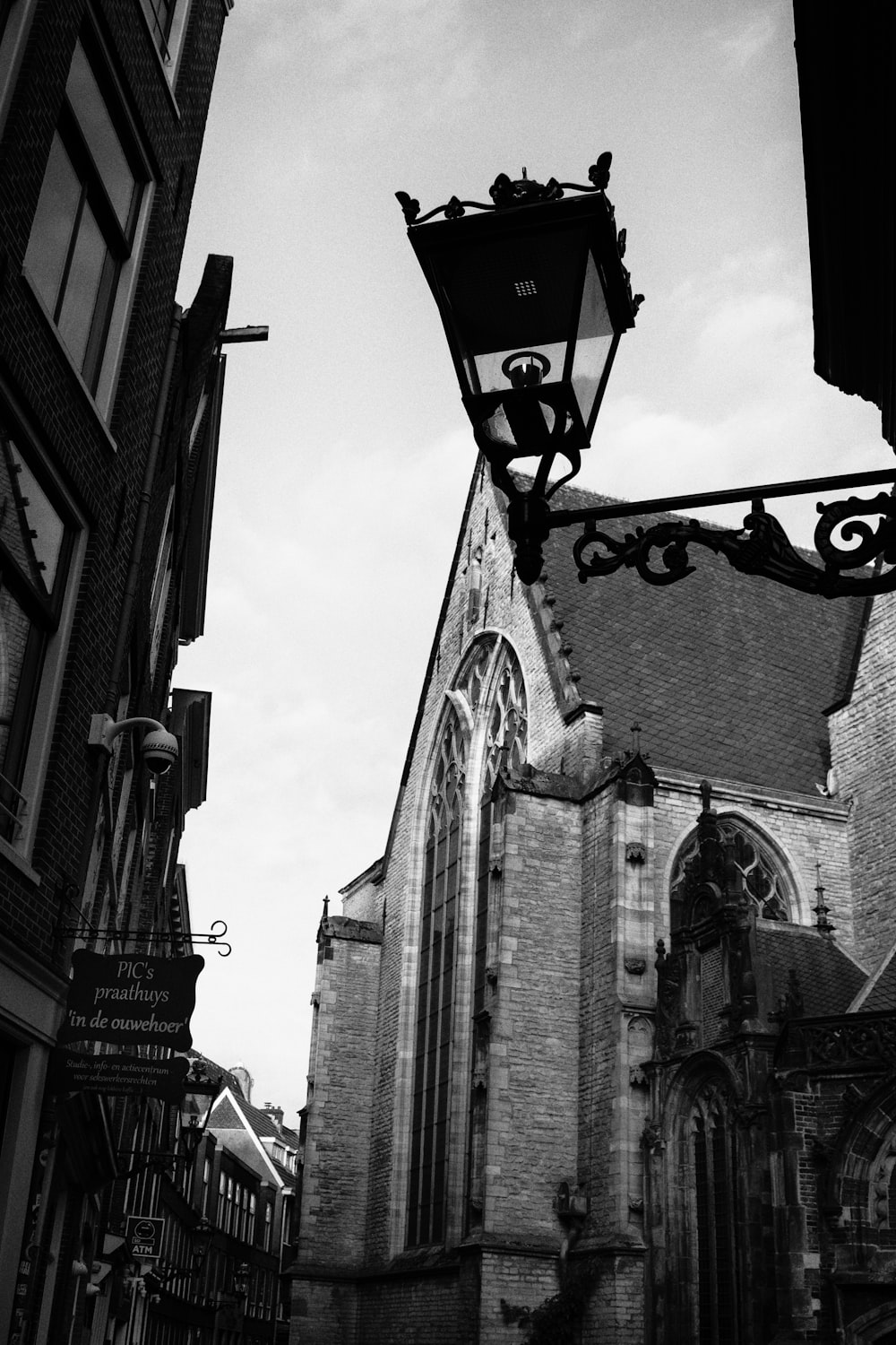 a black and white photo of a street light