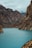 body of water under hills at daytime