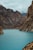 body of water under hills at daytime