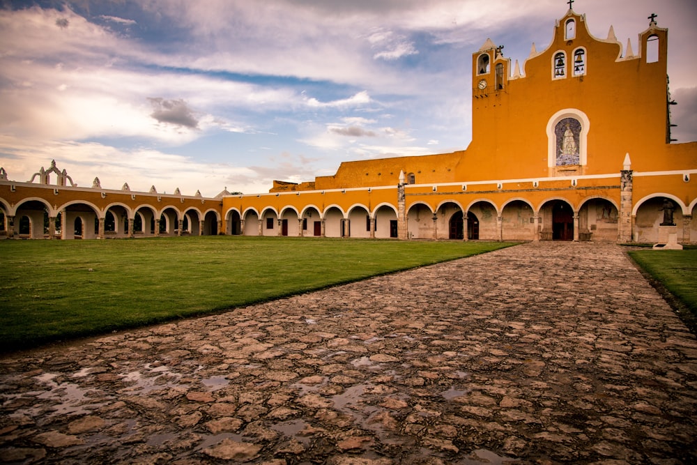 church near grass and pathway during day