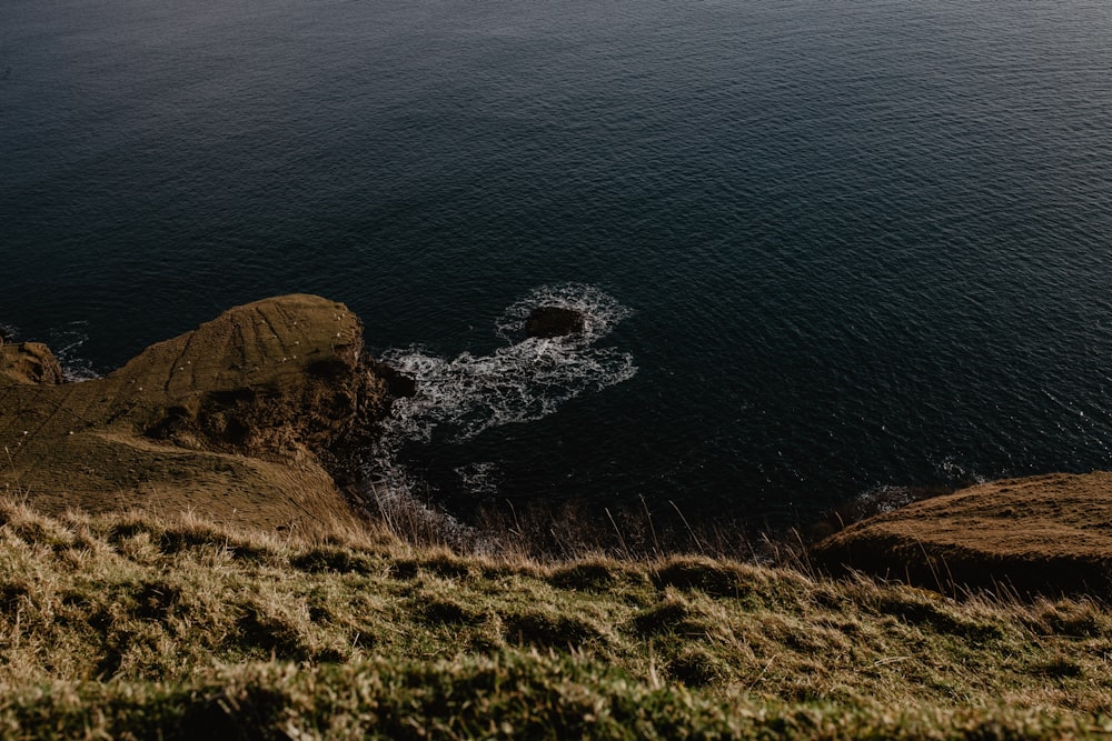 body of water near mountain