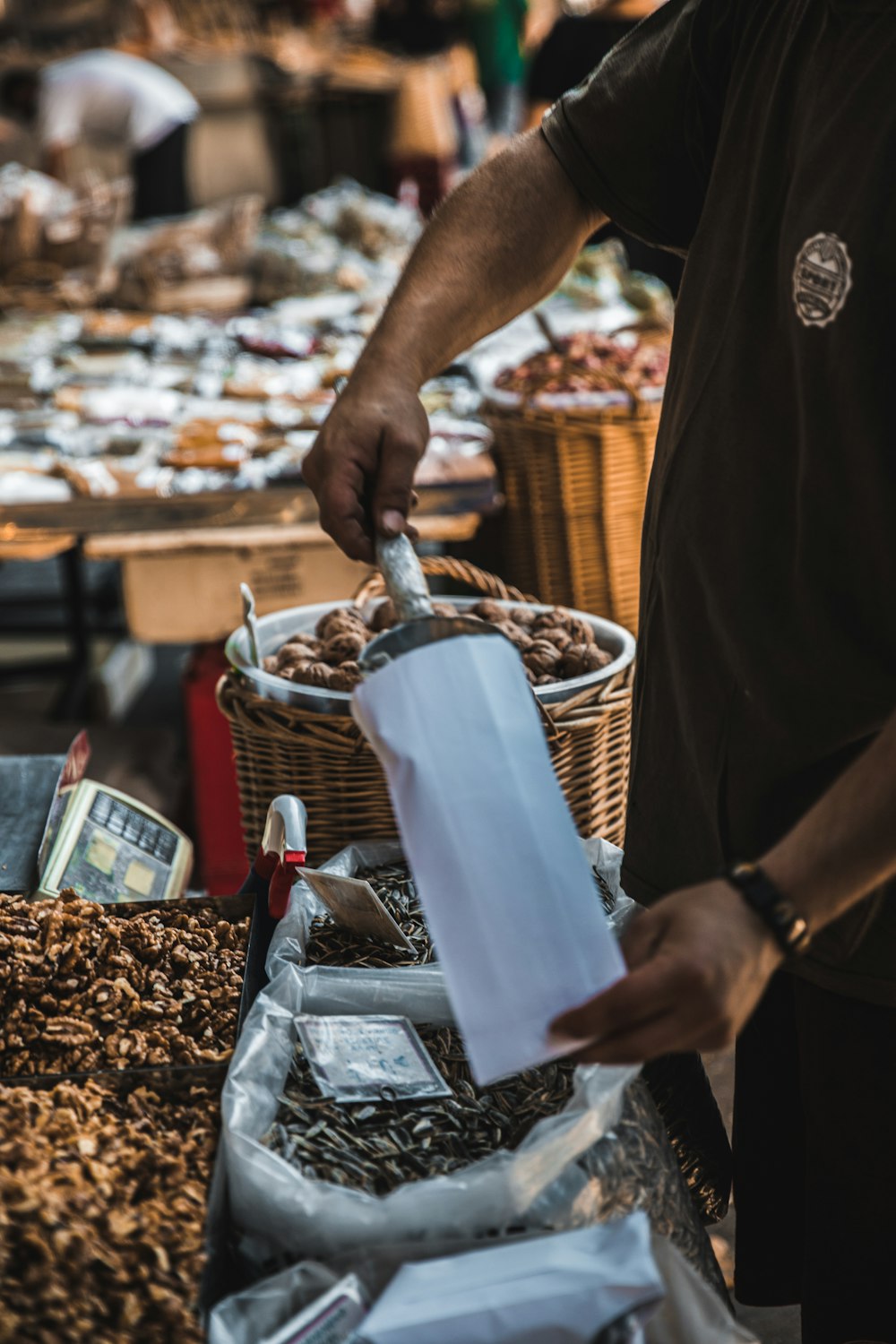 person scooping seeds in pack