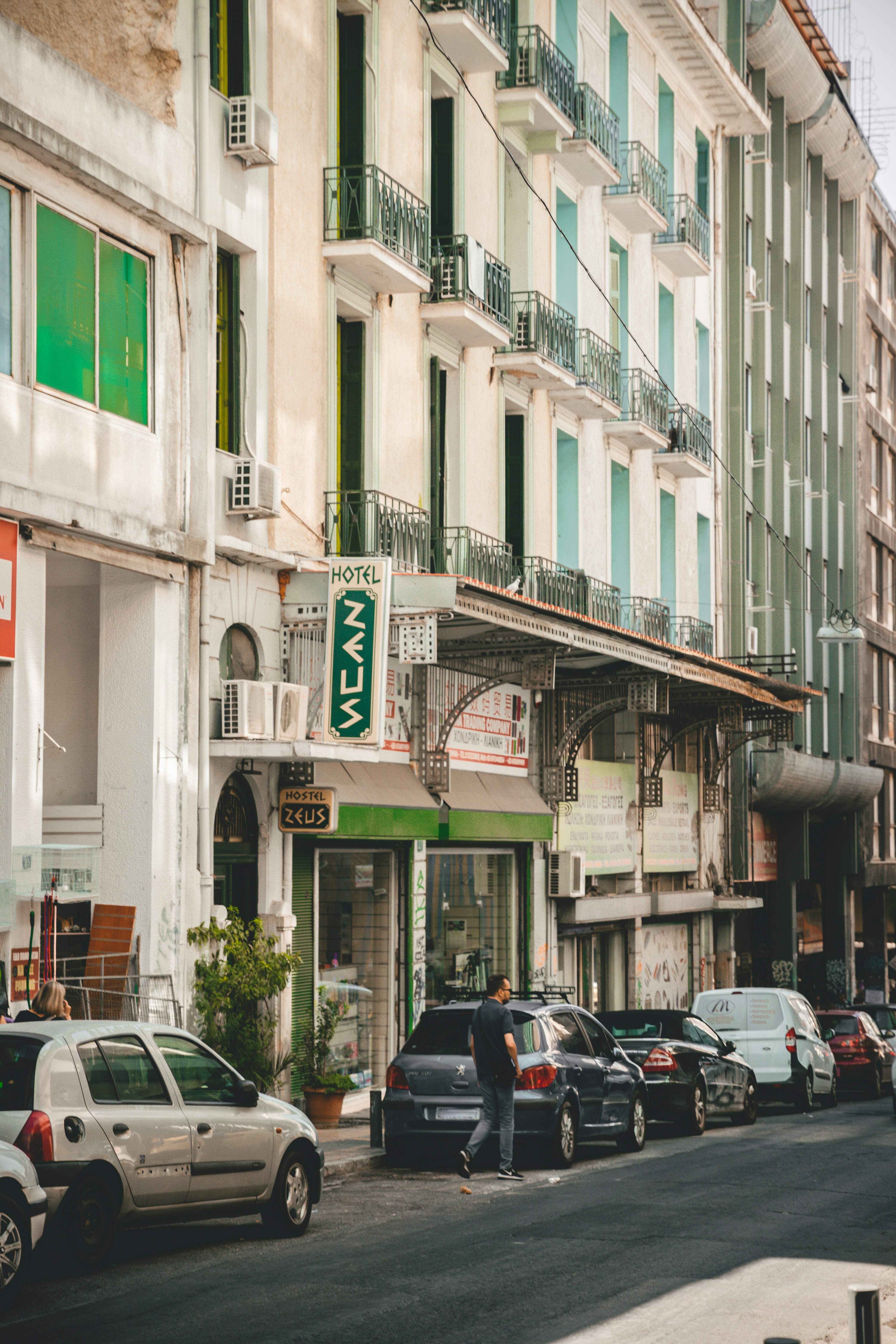 man standing beside vehicle