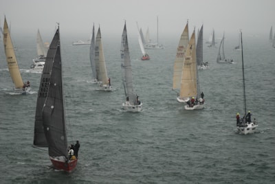 An aerial view of a sailing competition with multiple boats.