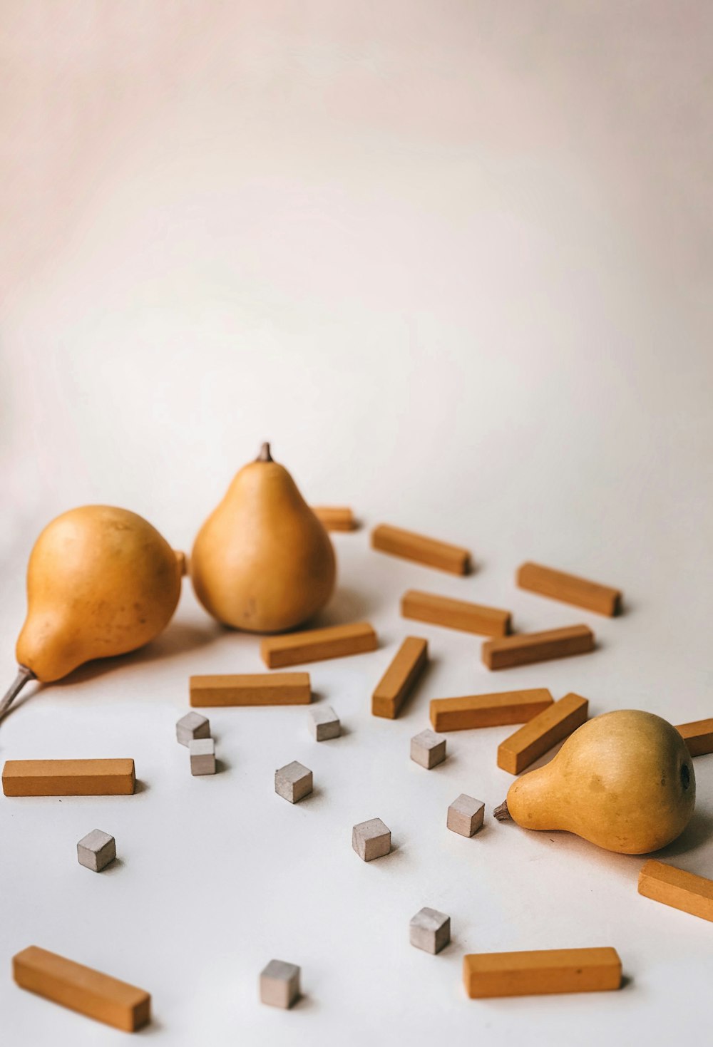 three brown gourds on white surface