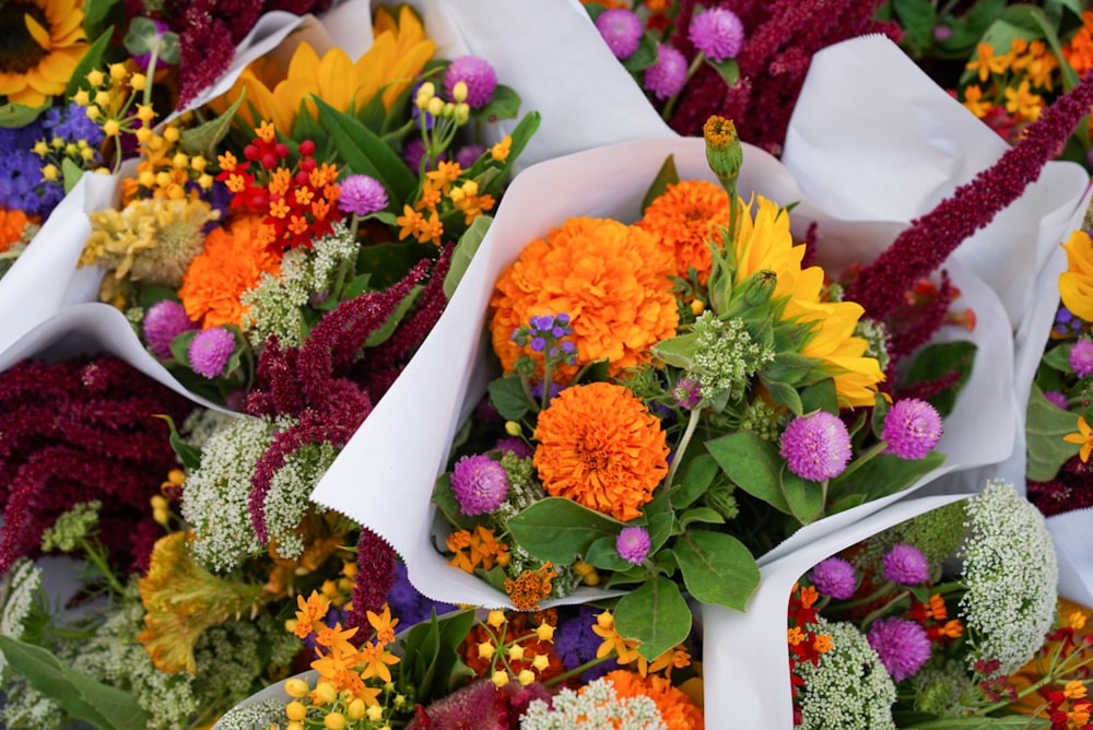 a bunch of flowers that are sitting on a table