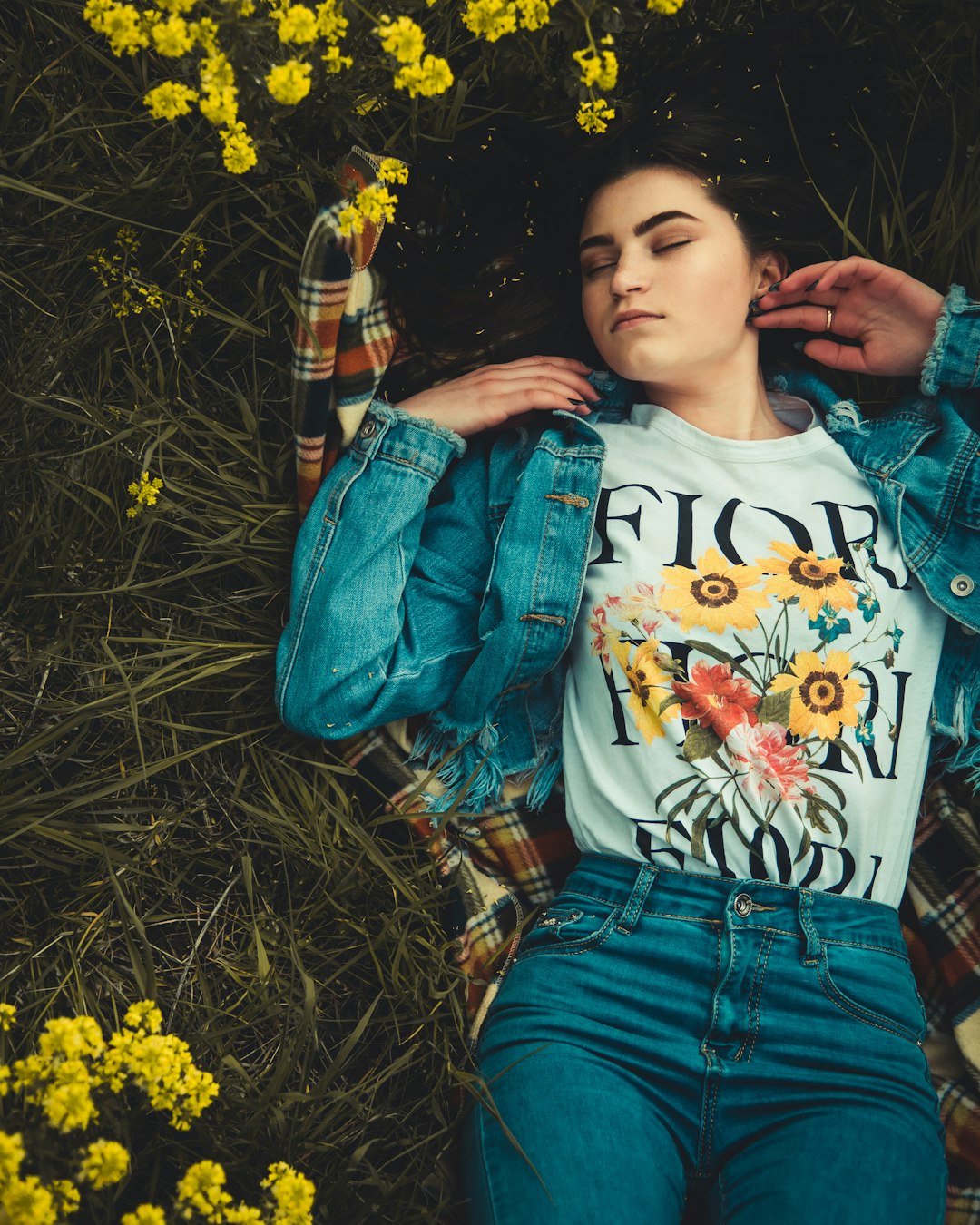 woman laying down on grass