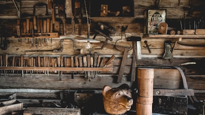 a bunch of tools hanging on a wall