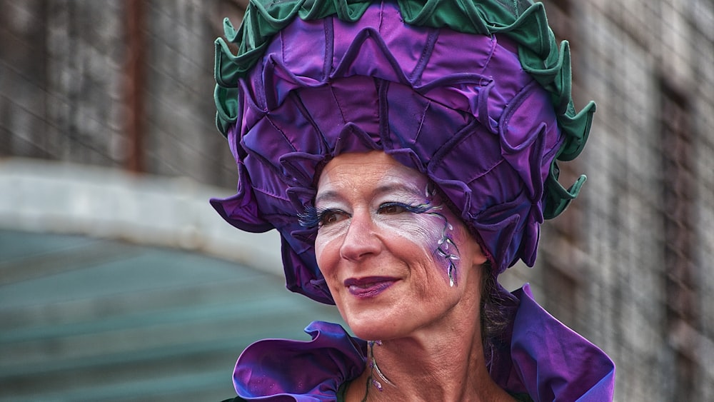 focus photography of woman in purple hat