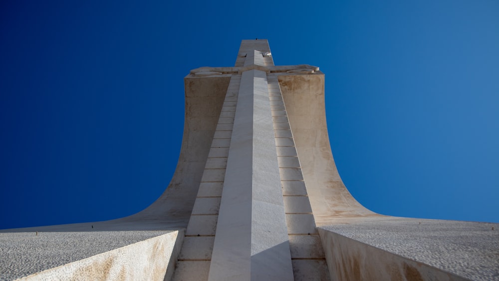 the top of a tall building with a sky in the background