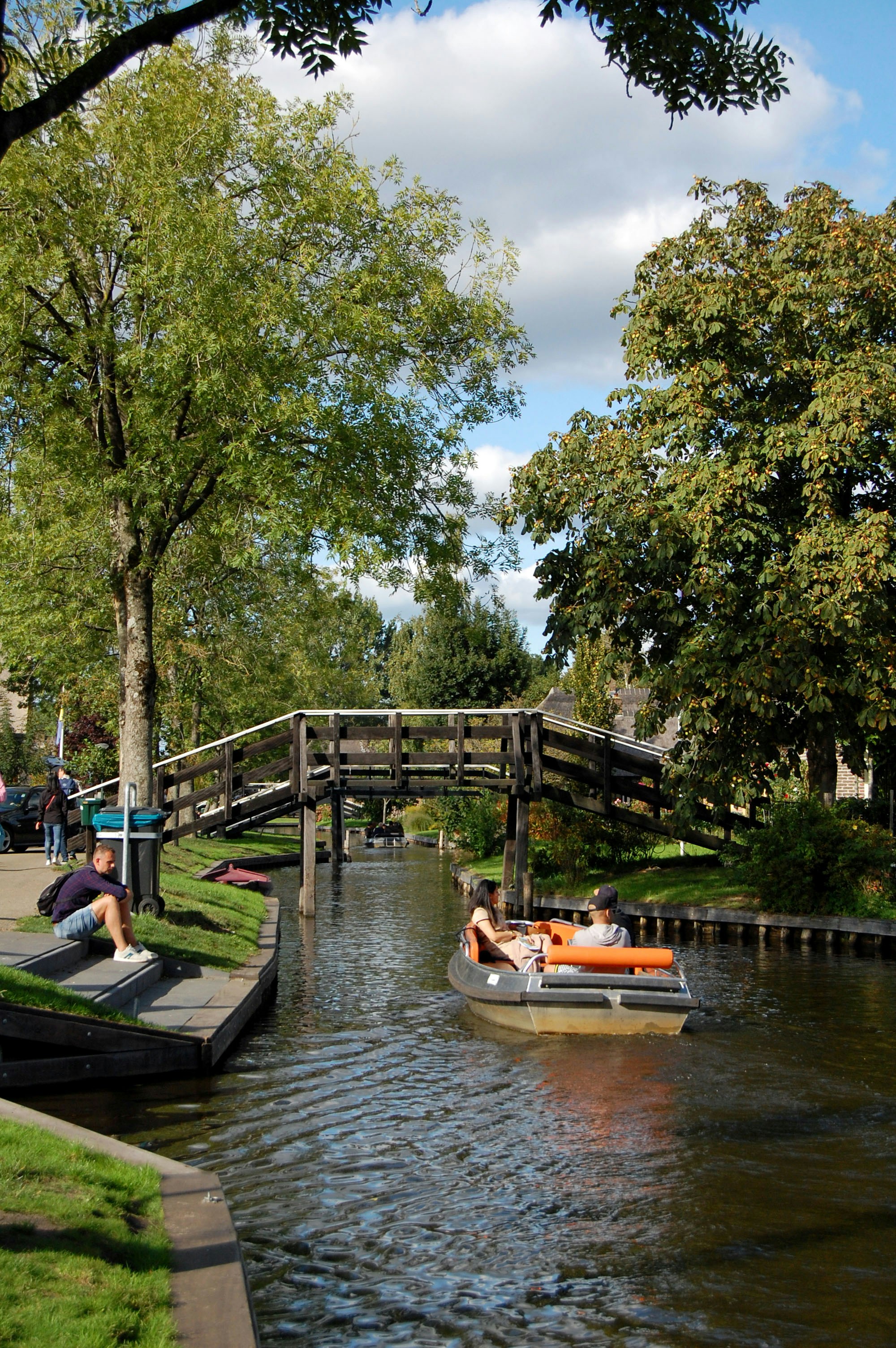 black boat on body of water during daytime