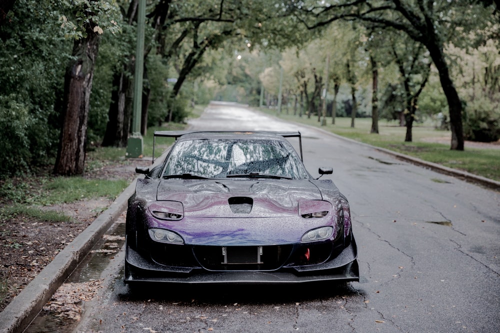 purple lazy eye sports car on road