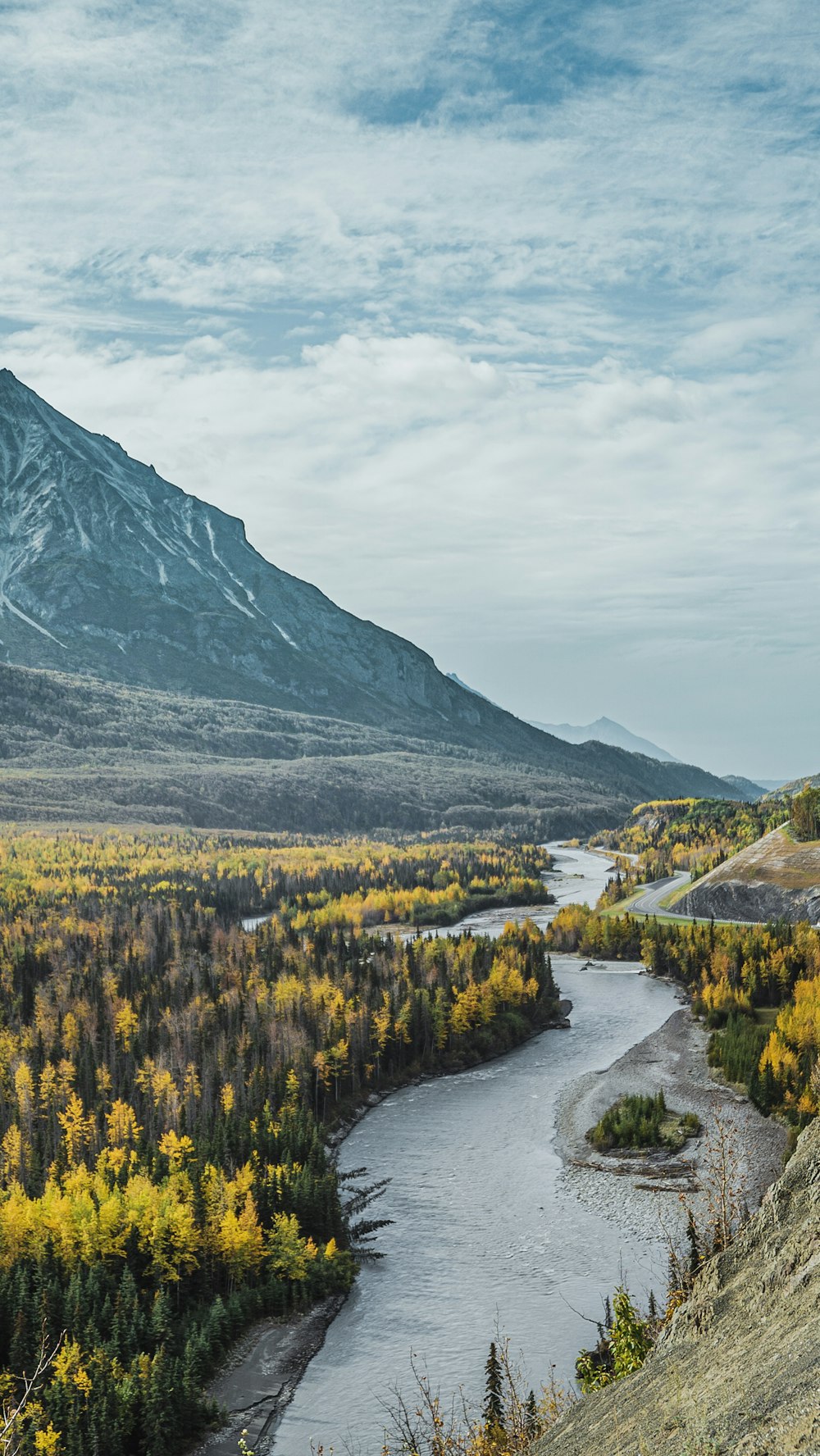 aerial photo of mountain under cloudy sky