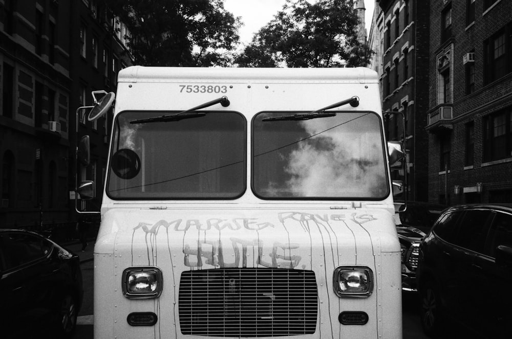 grayscale photography of a box truck