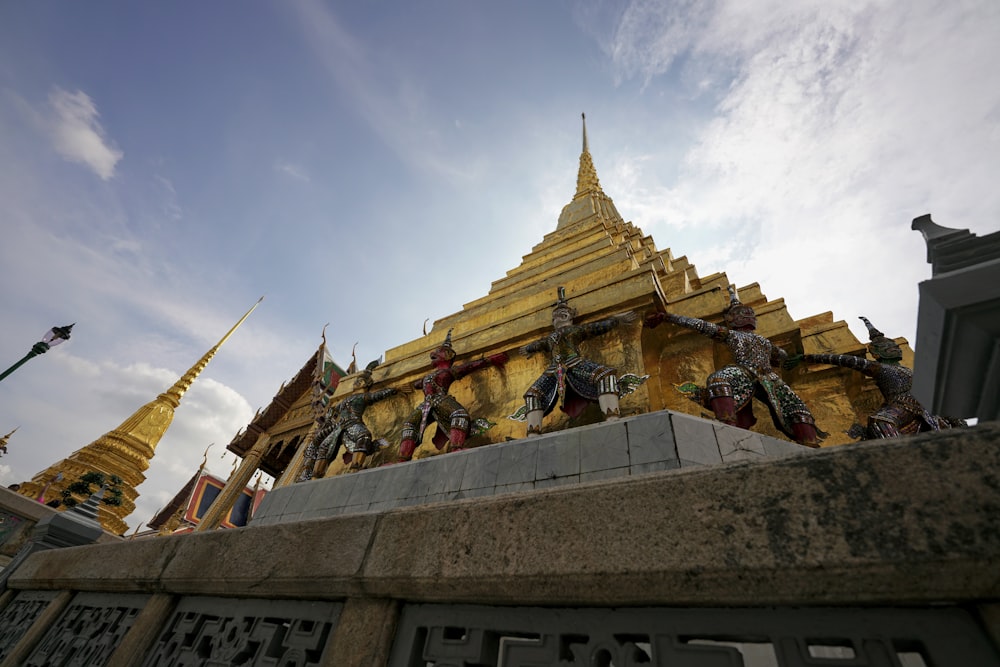 yellow temple under white and blue skies during daytime