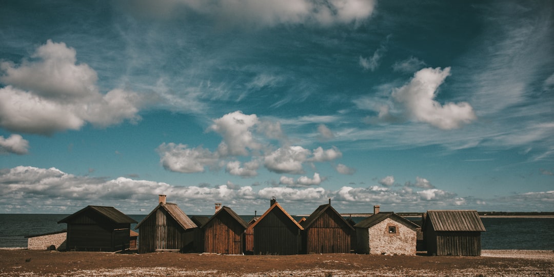 cabins under cloudy sky during daytime