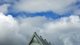 Modern rooftop with sharp edges against a clear blue sky in Klosters