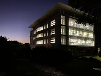 A sleek modern building equipped with advanced fire safety systems at dusk.