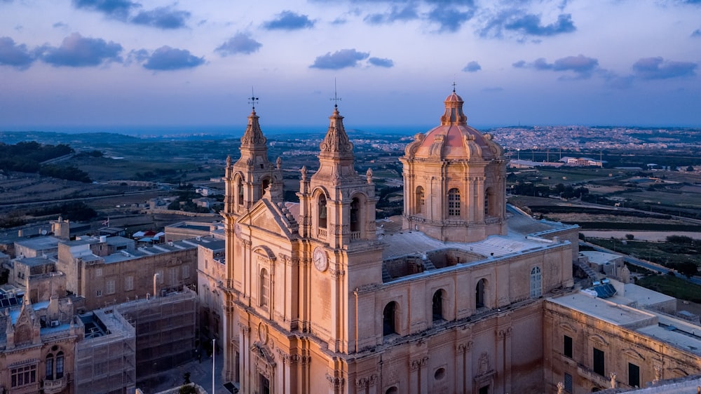 an aerial view of a cathedral in a city