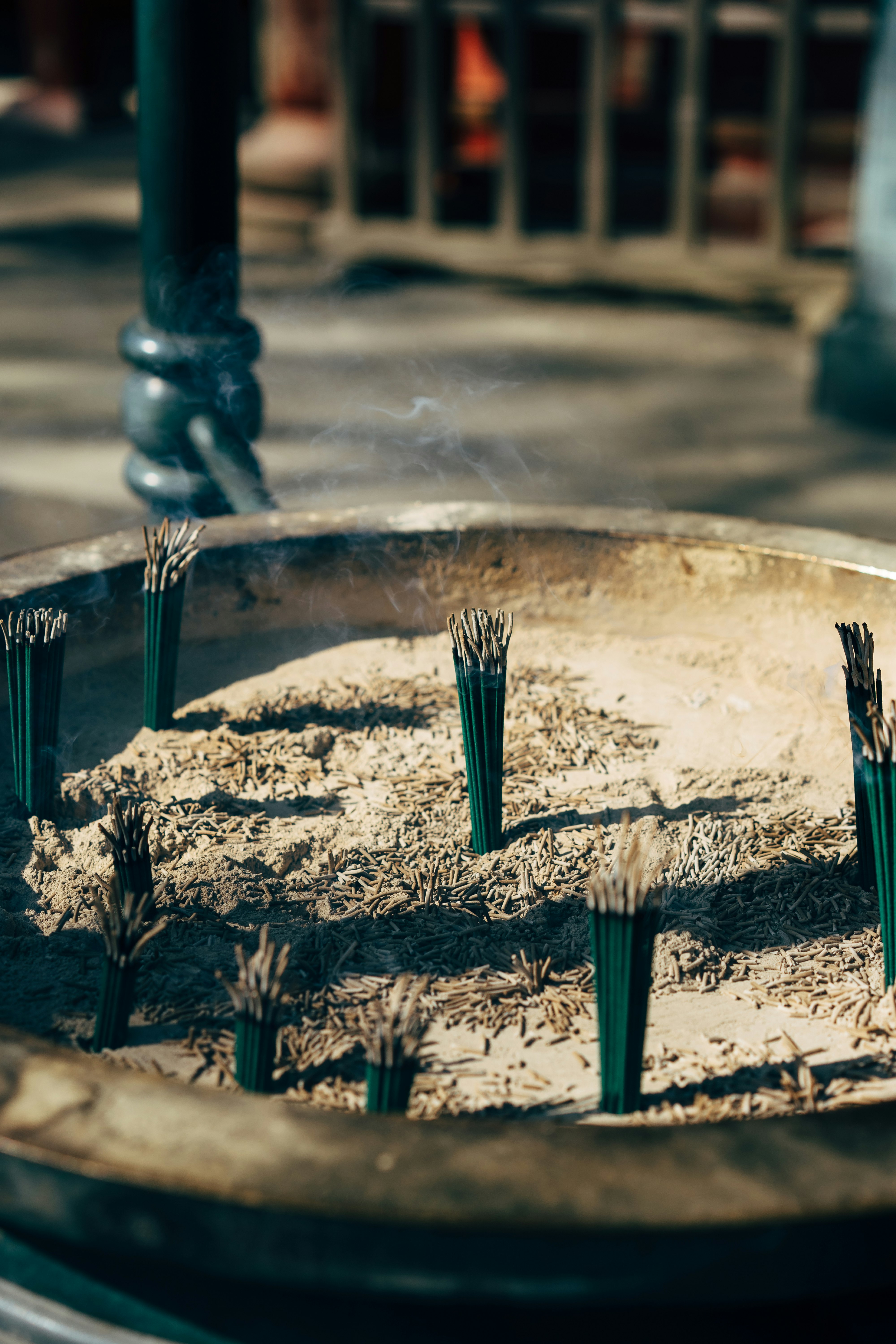 incense sticks in sand