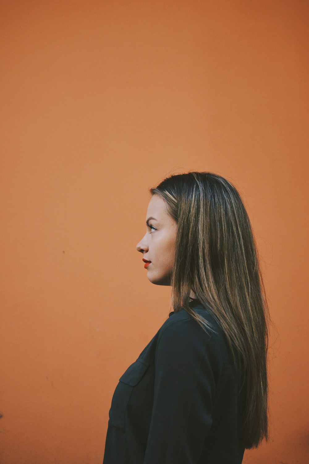 woman in black top facing sideways