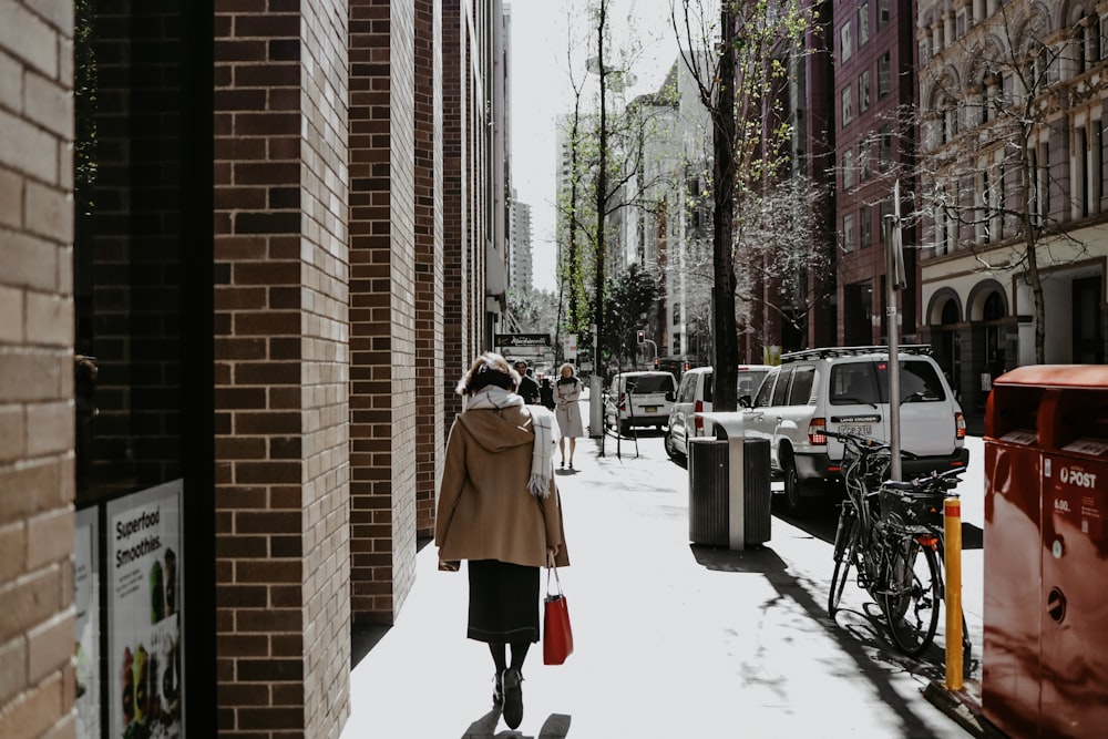 woman walking on a sidewalk