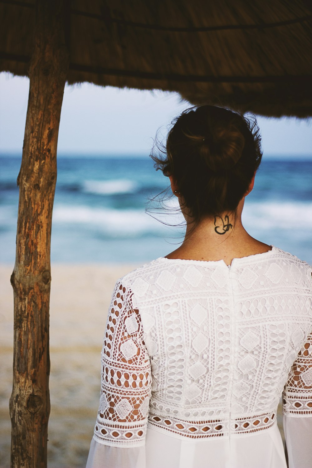 woman wearing white floral dress