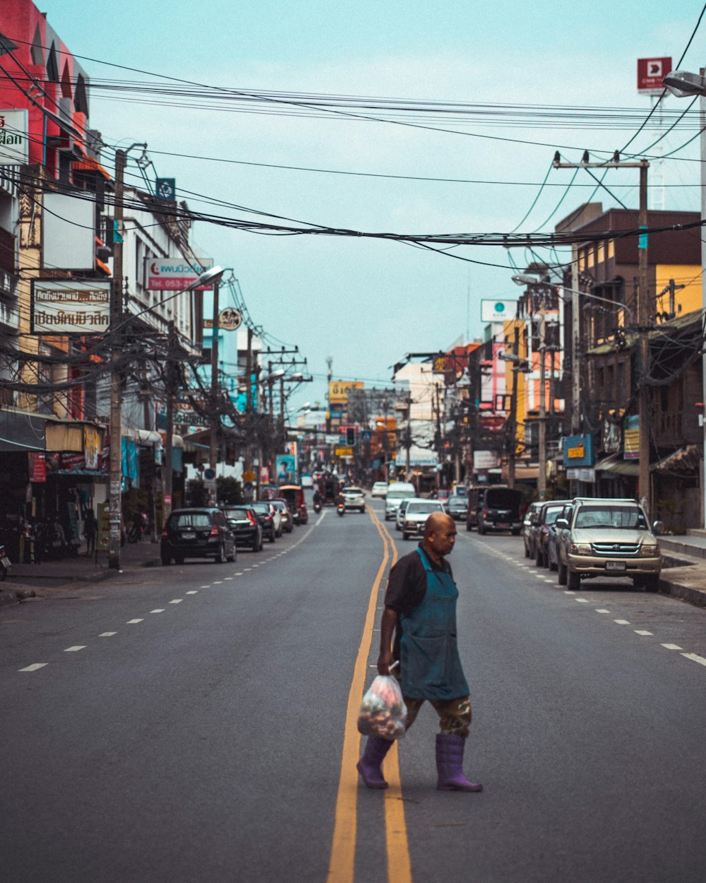 man crossing on road