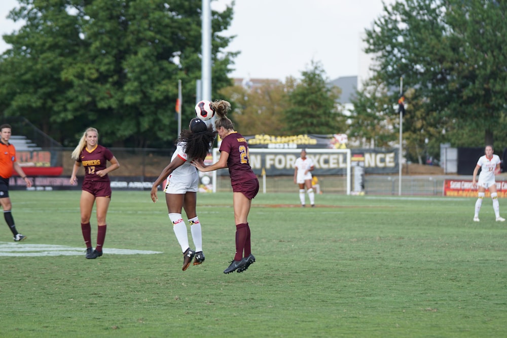 women playing football during daytime