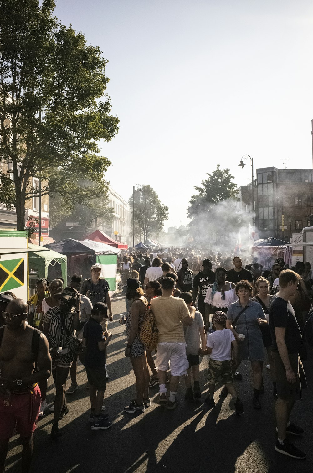 crowd of people by building during daytime