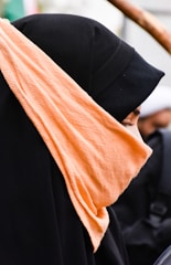 woman wearing black abaya dress