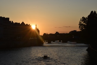 Sunset view over the Maumee River with downtown Toledo skyline in the background.