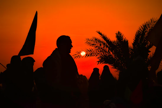 A striking portrait of community members collaborating under a vibrant orange sky, symbolizing hope and action.