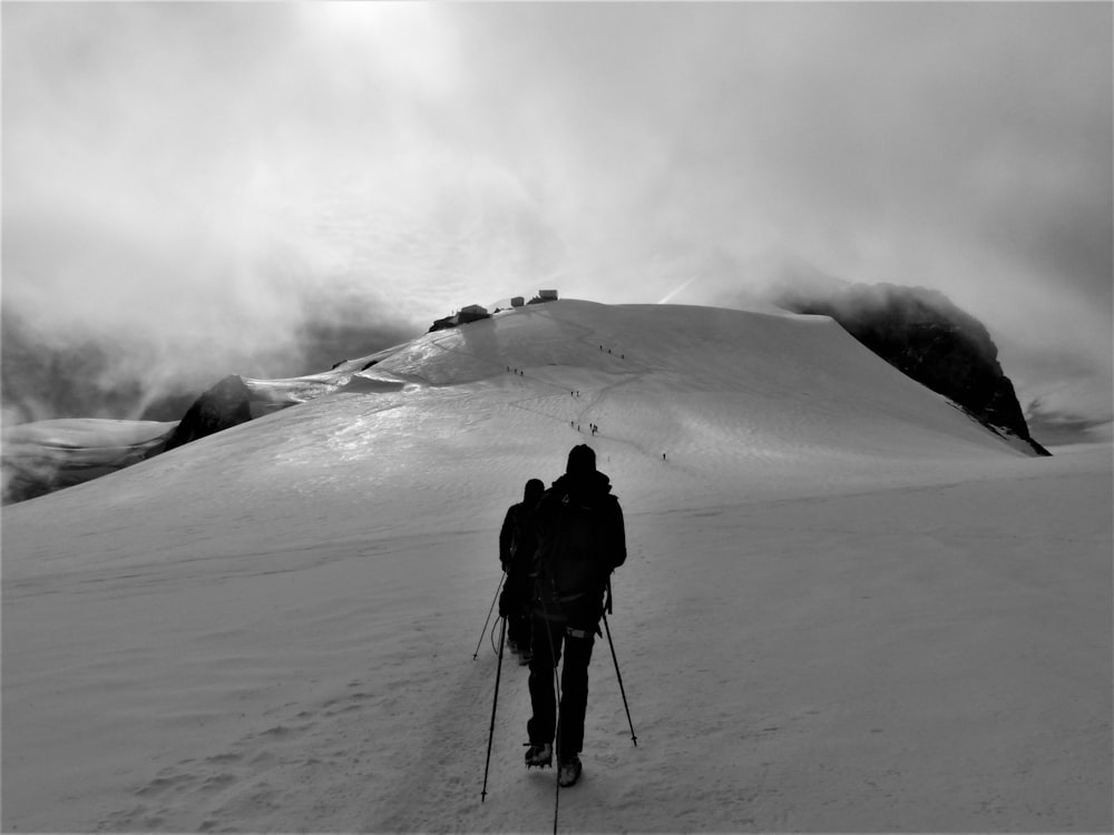 silhouette of man walking on snowfield