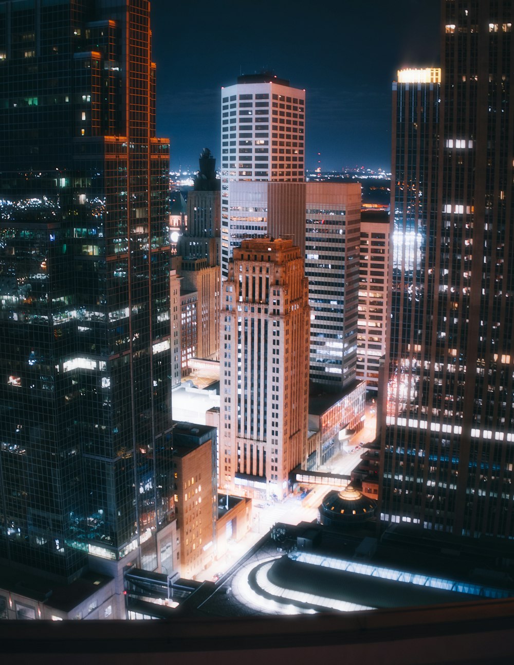 lighted high-rise buildings at night