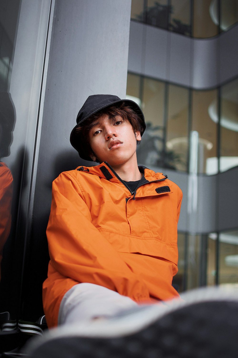 boy in orange jacket