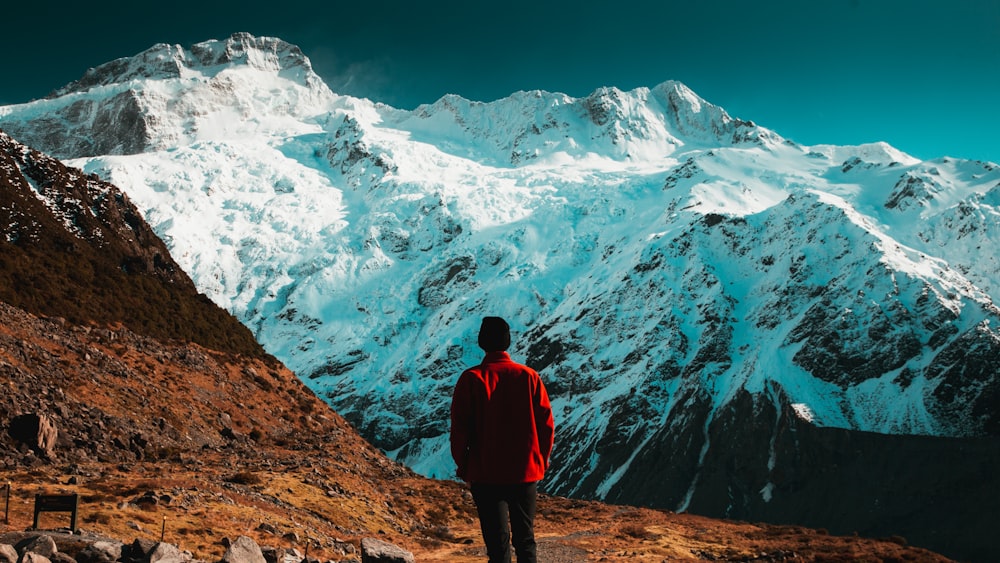 man overlooking mountains