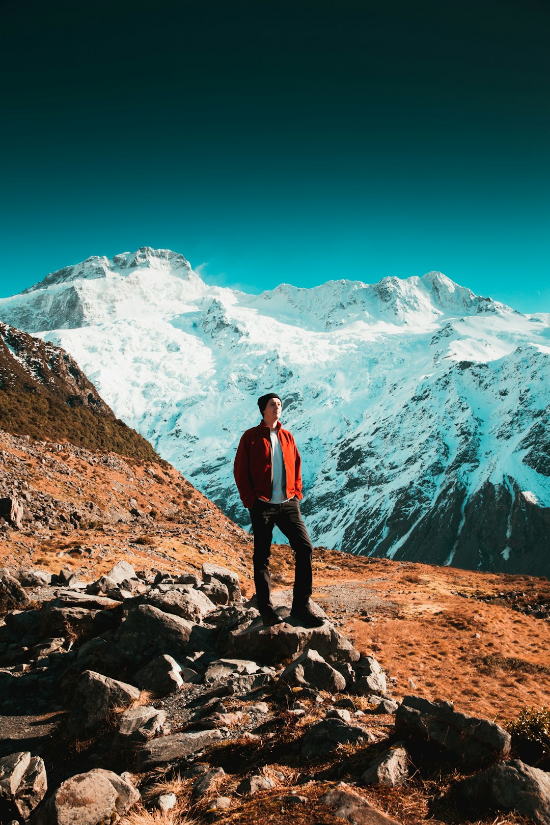 man standing on stone during daytime