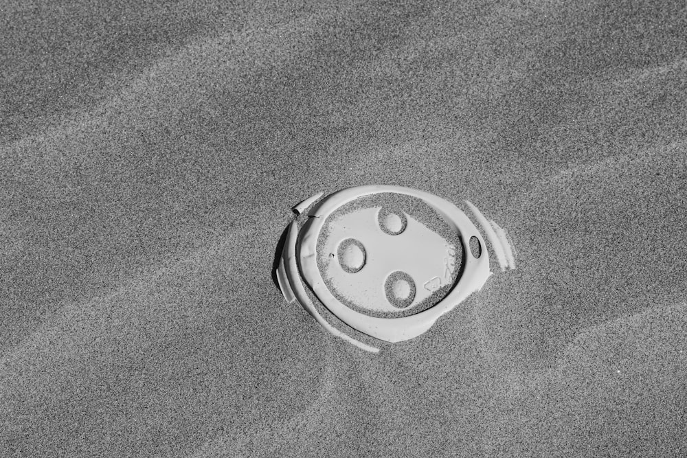 round white decor on black sand