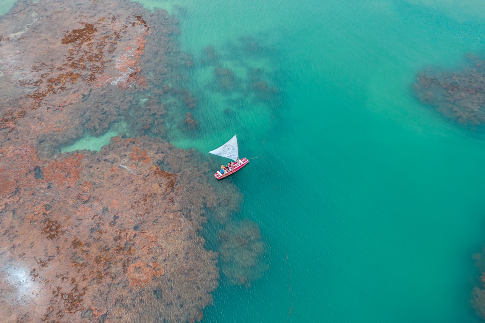 boat on body of water during daytime aerial view photography