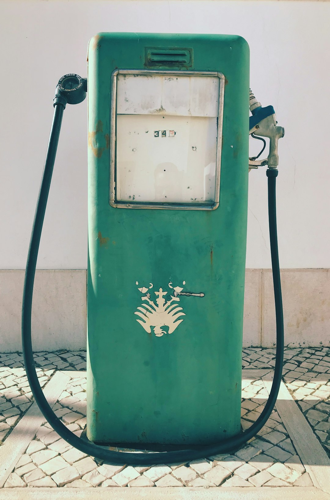 green gasoline pump
