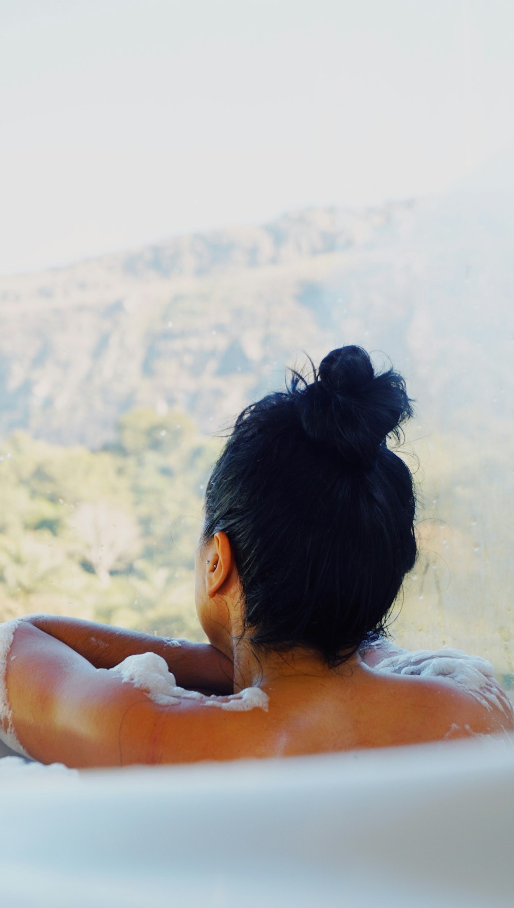 topless woman in tub