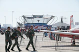 Group of students wearing flight suits preparing for a practical lesson outside