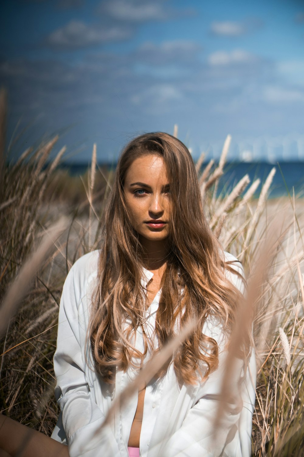 woman wears white cardigan